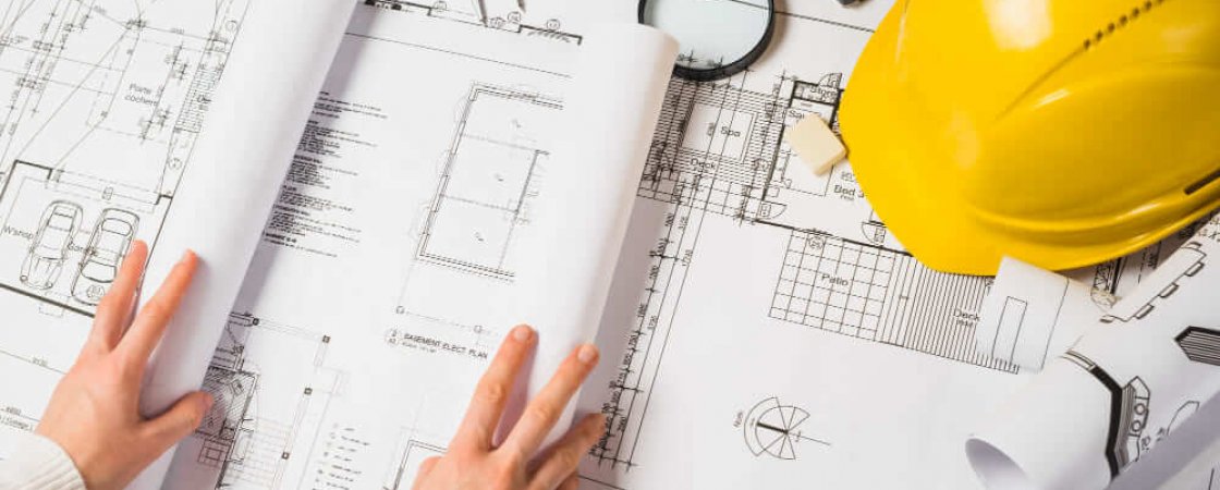 crop-architect-opening-blueprint (1) construstion marketing